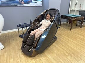 The Grand Prize Winner tried on the massage chair